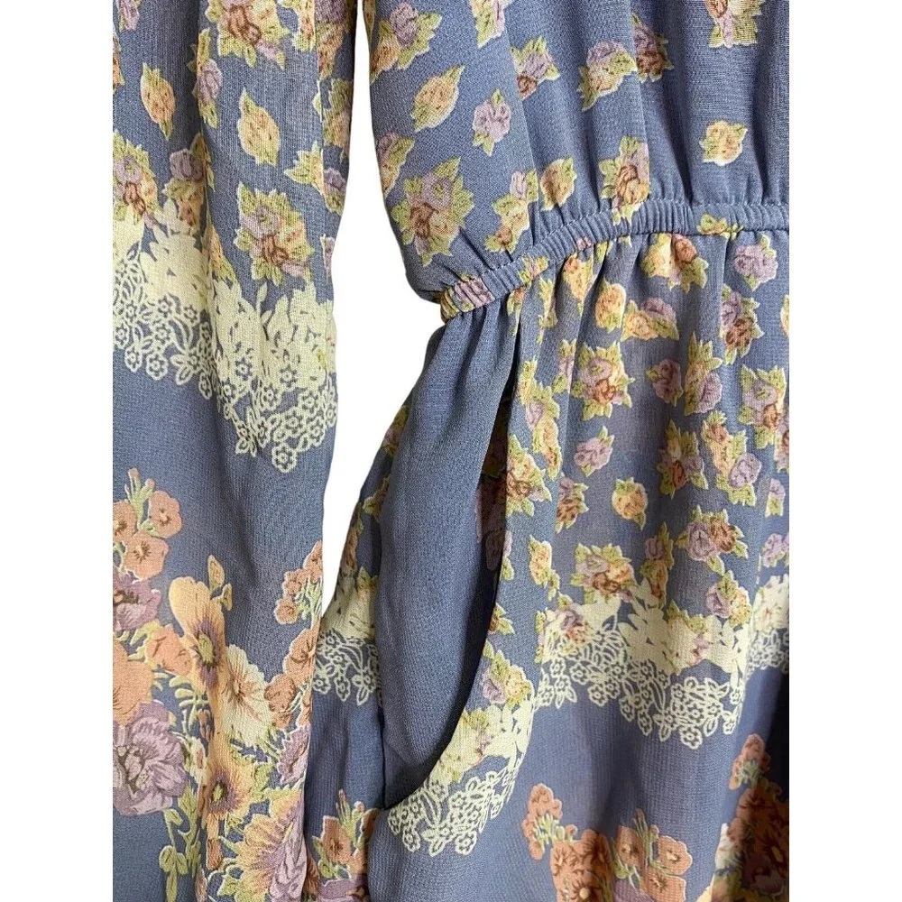 The Hanger Floral Romper Size Medium Baby Blue Long Sleeve Pockets Floral Shorts